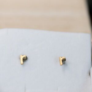 Gold R earrings